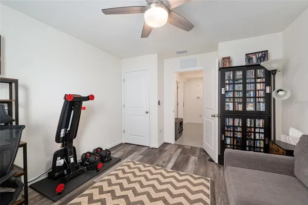 a front view of a house with a garden and yard