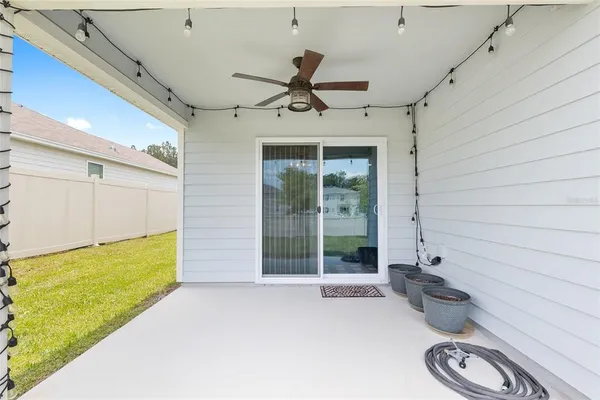 a view of a house with pool and a yard