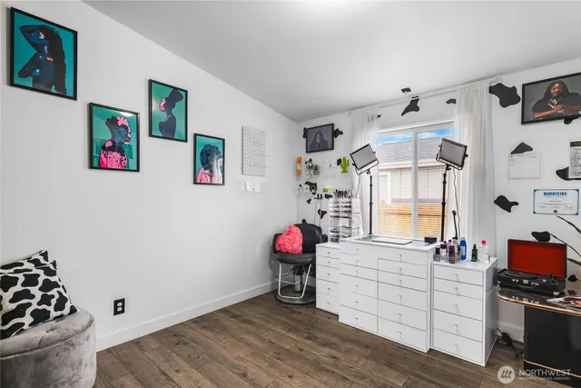 a view of living room with furniture and wooden floor