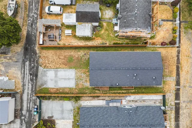 aerial view of a house with a yard