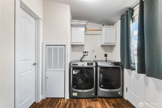 a kitchen with a stove a washer and dryer