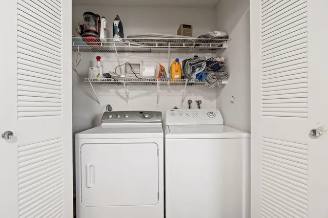a utility room with dryer and washer