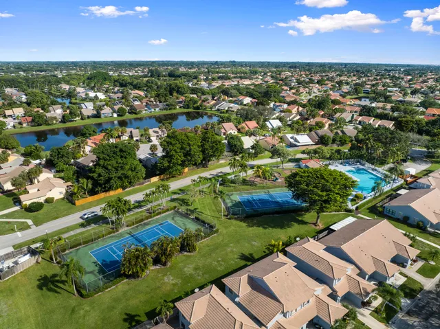 an aerial view of residential houses with outdoor space and river