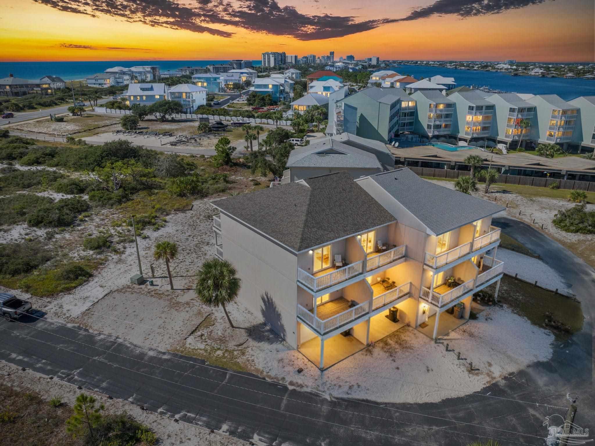 an aerial view of a house with a swimming pool