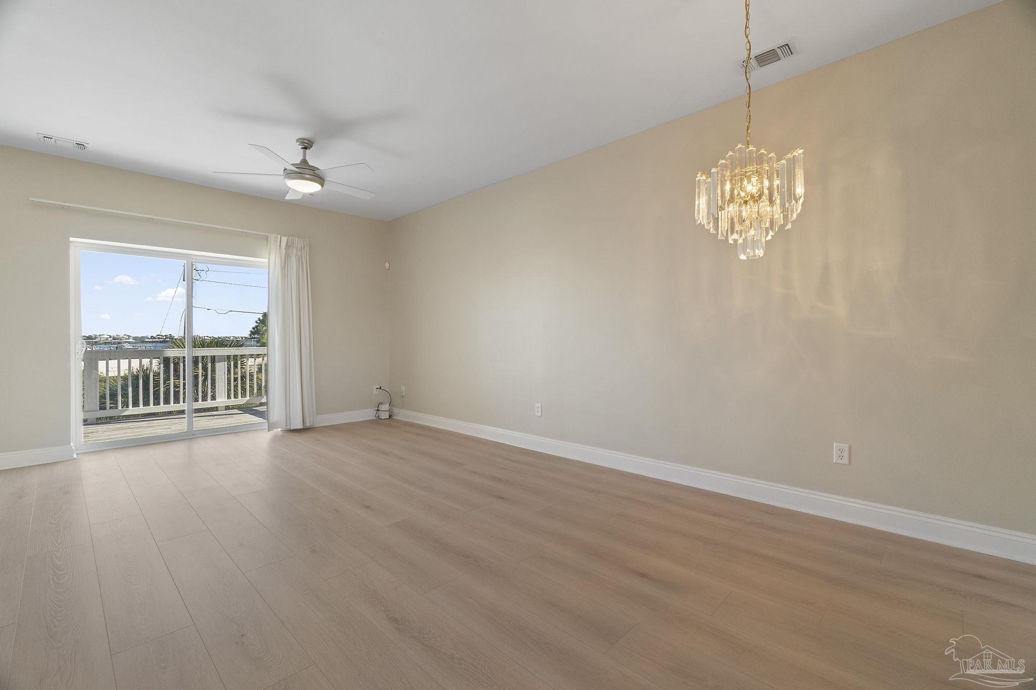 16300 Perdido Key Drive, Unit 20 Perdido Key, FL 32507 - Photo 13 of 47 wooden floor in an empty room with a window