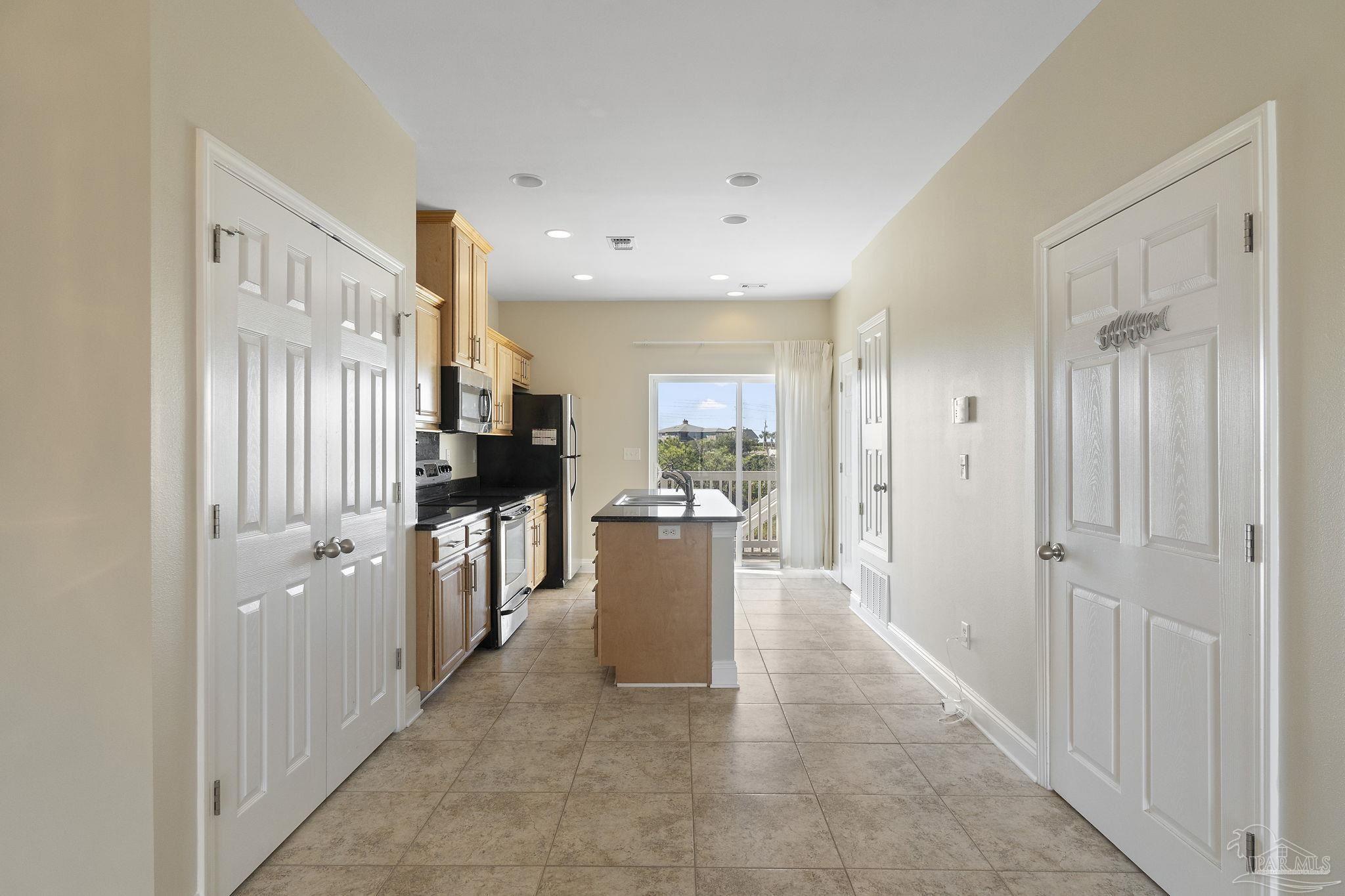 16300 Perdido Key Drive, Unit 20 Perdido Key, FL 32507 - Photo 16 of 47 a view of a kitchen with a refrigerator in a kitchen