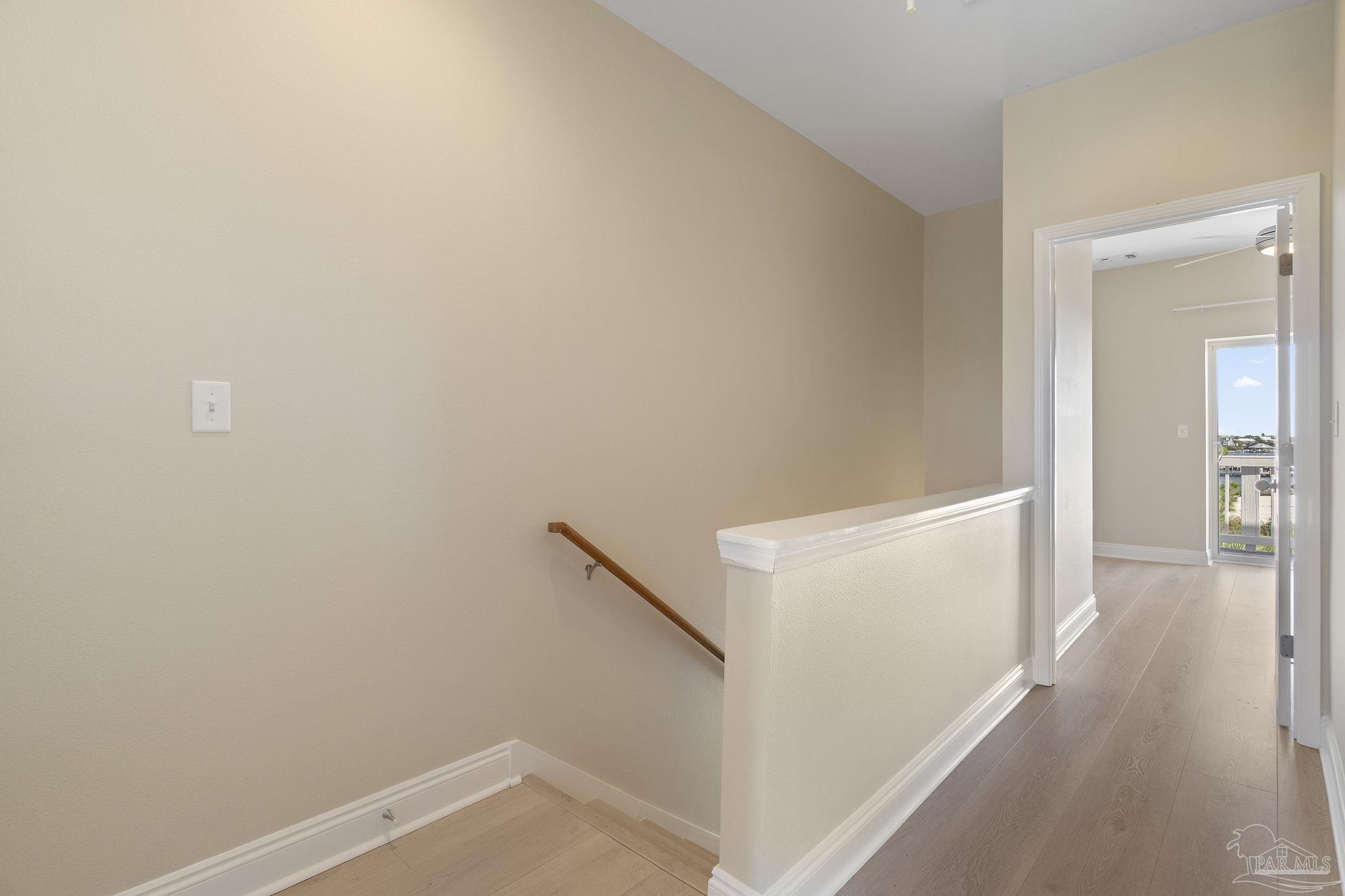 16300 Perdido Key Drive, Unit 20 Perdido Key, FL 32507 - Photo 23 of 47 a view of a hallway with wooden floor