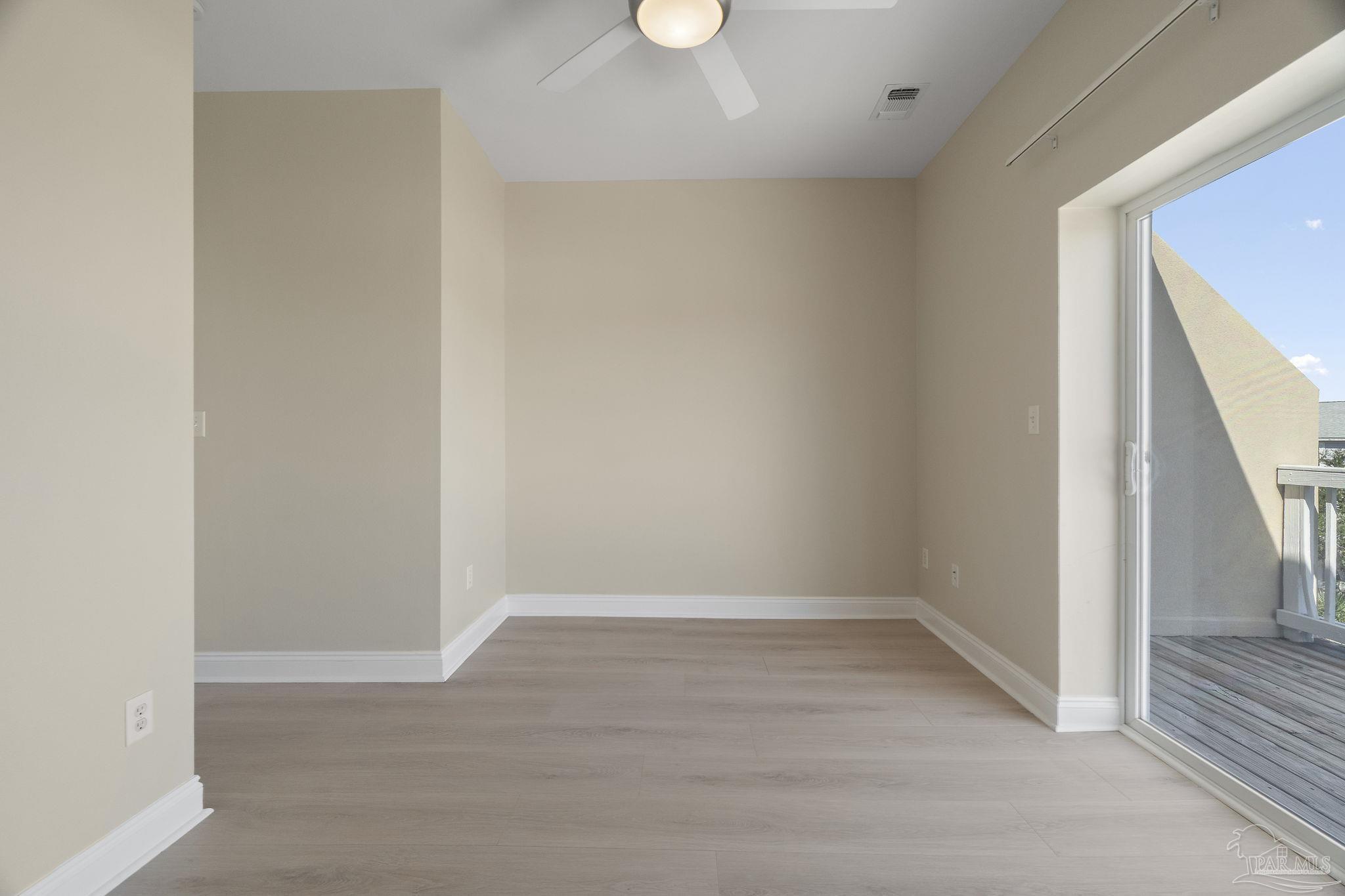 16300 Perdido Key Drive, Unit 20 Perdido Key, FL 32507 - Photo 29 of 47 a view of an empty room with wooden floor and a window