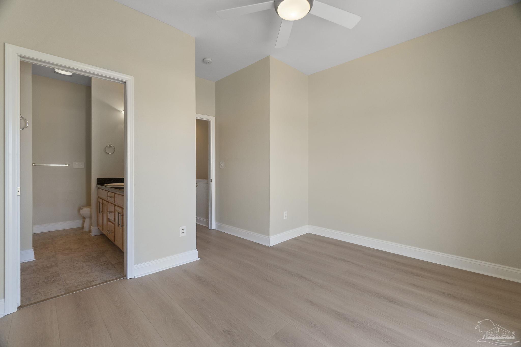 16300 Perdido Key Drive, Unit 20 Perdido Key, FL 32507 - Photo 30 of 47 a view of a room with wooden floor and a bathroom