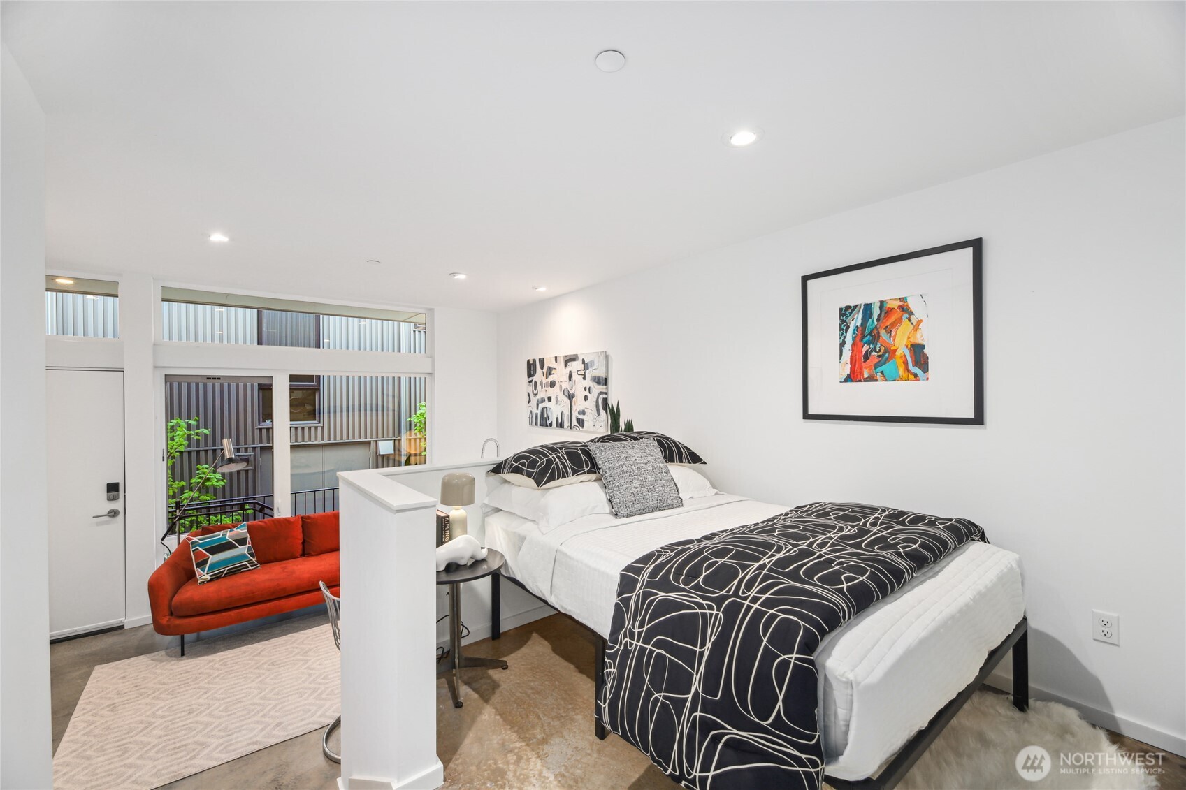 115 East Allison Street Seattle, WA 98102 - Photo 13 of 23 a bedroom with furniture and a large window