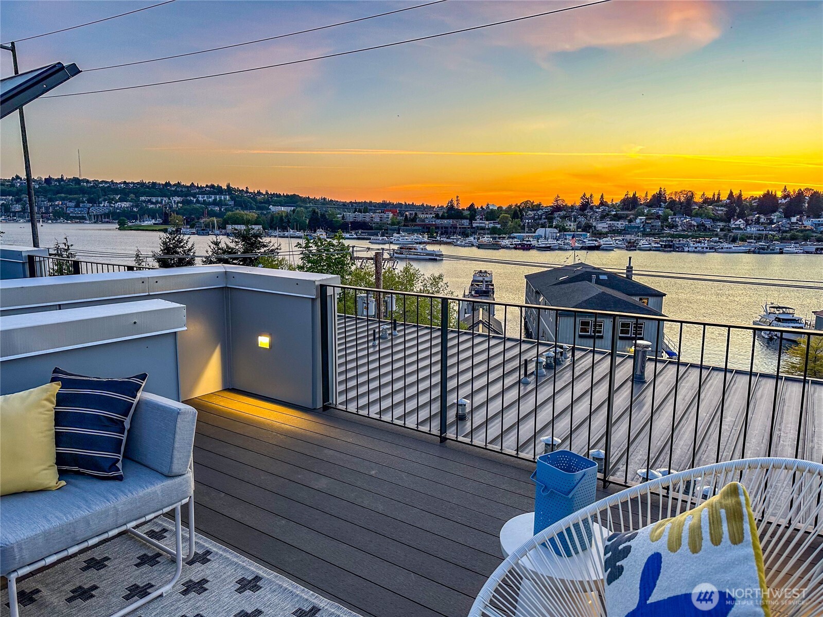 115 East Allison Street Seattle, WA 98102 - Photo 23 of 23 a view of a balcony with wooden floor and city view
