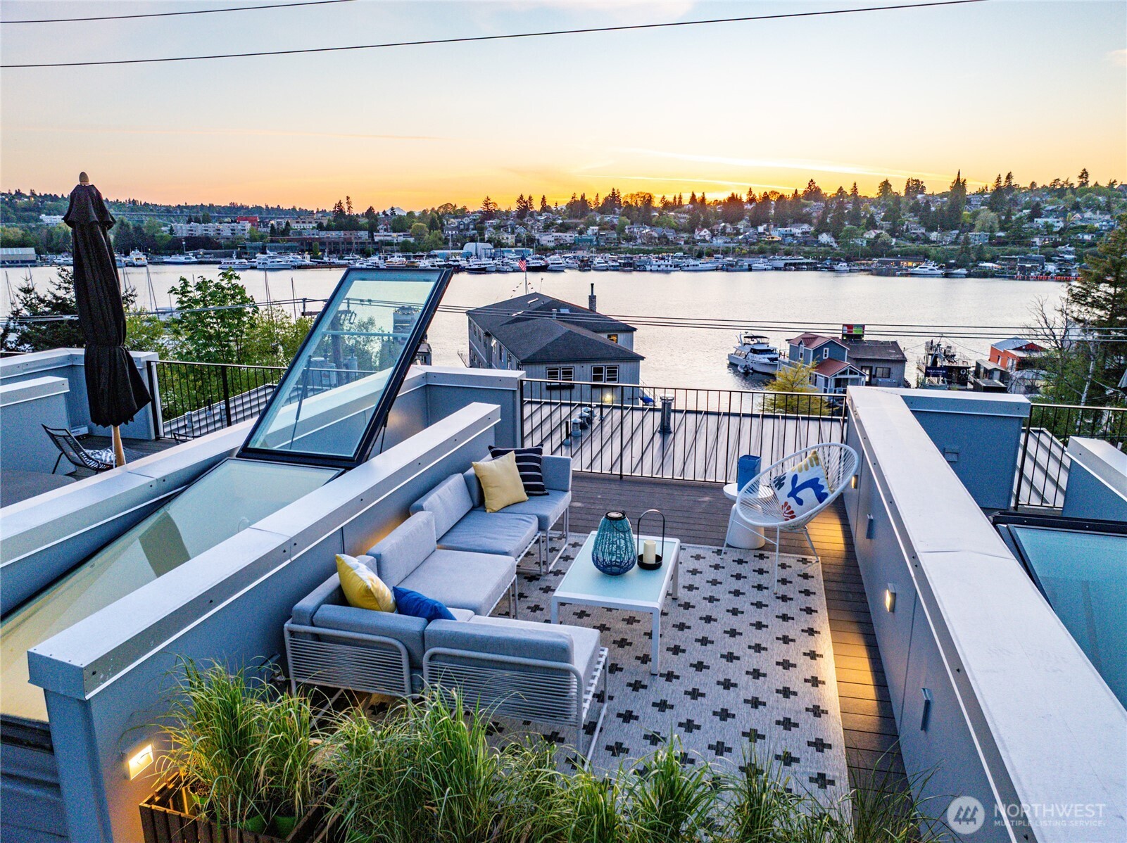 115 East Allison Street Seattle, WA 98102 - Photo 6 of 23 a view of a balcony with two chairs and a potted plant