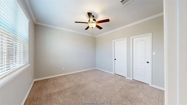 a view of a livingroom with a ceiling fan and window