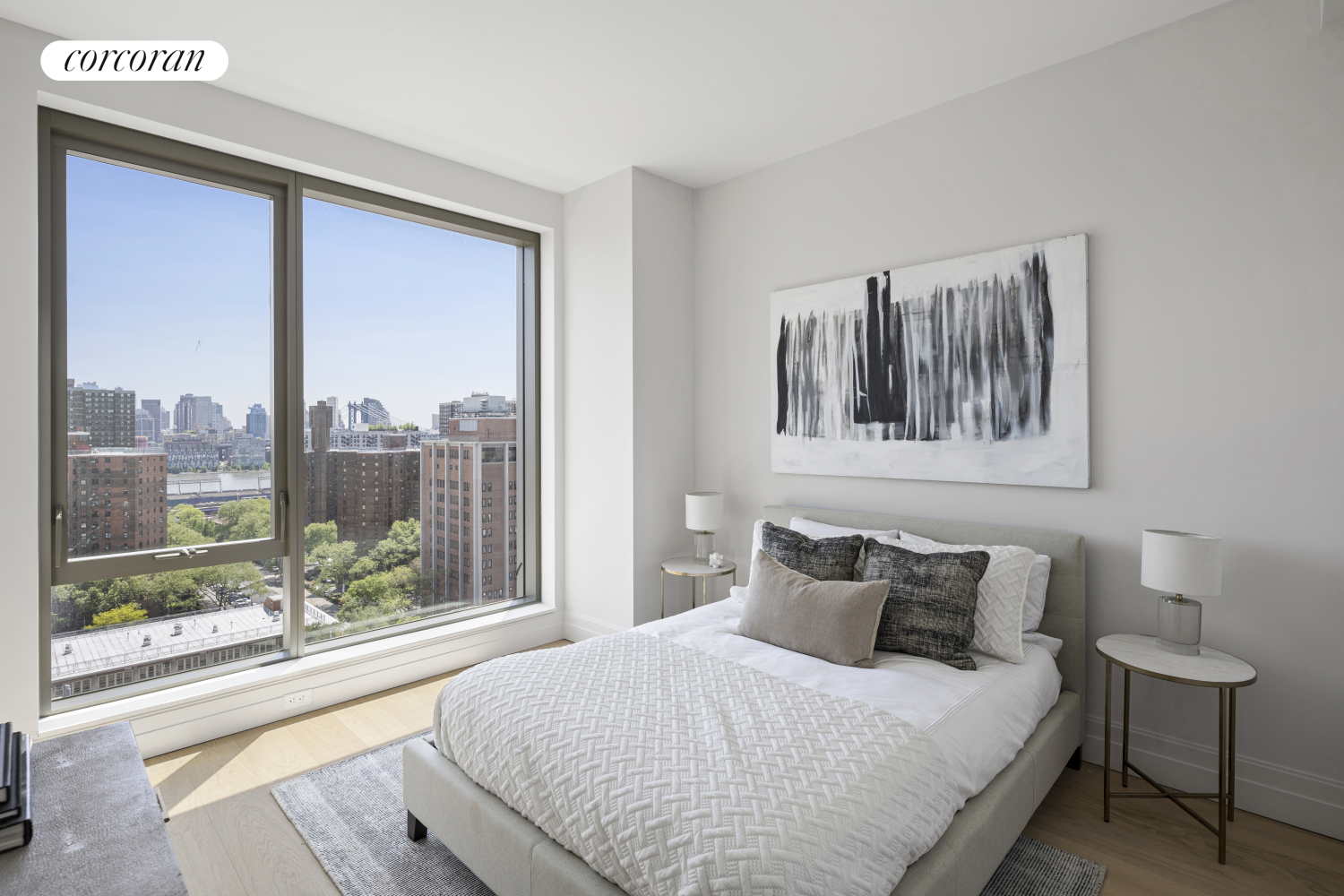 222 East Broadway, Unit 14A Manhattan, NY 10002 - Photo 4 of 6 a bedroom with a large bed and a large window