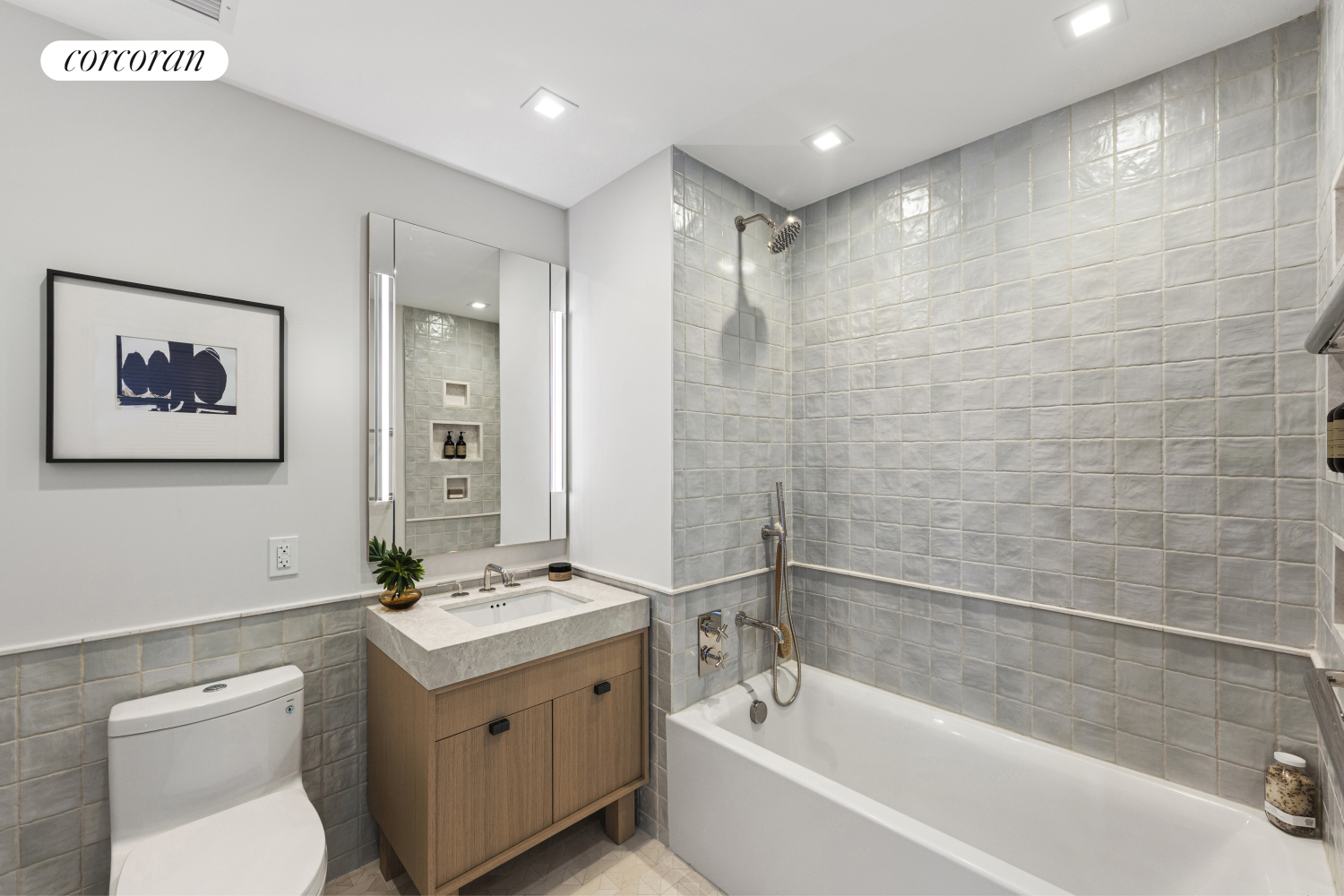 222 East Broadway, Unit 14A Manhattan, NY 10002 - Photo 5 of 6 a bathroom with a tub sink and mirror