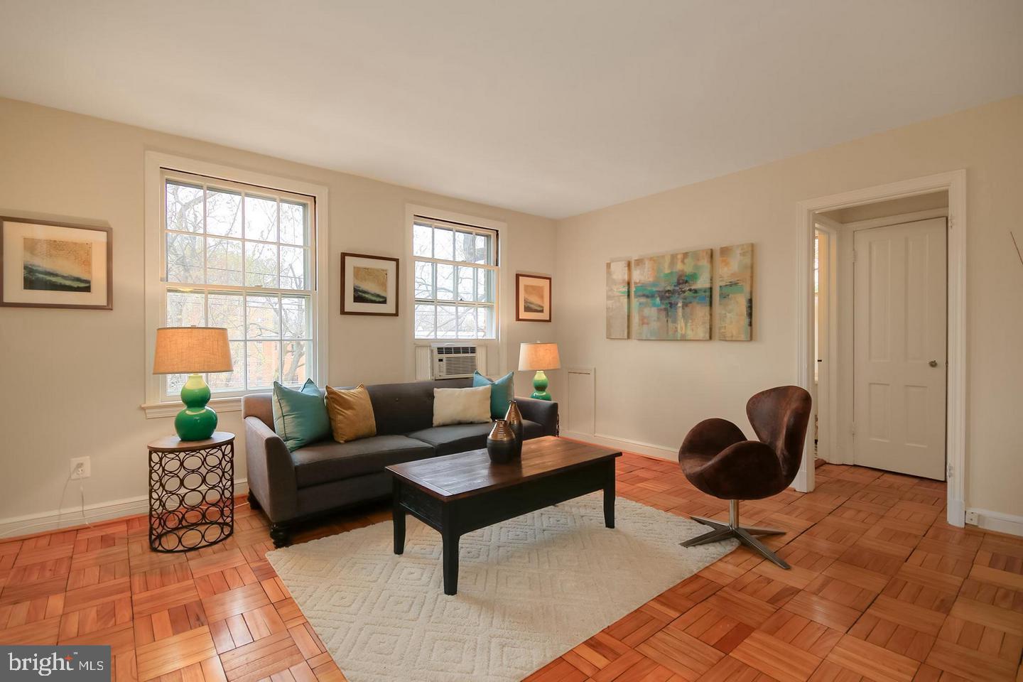2712 Ordway Street Northwest, Unit 5 Washington, DC 20008 - Photo 1 of 26 a living room with furniture a rug and a window