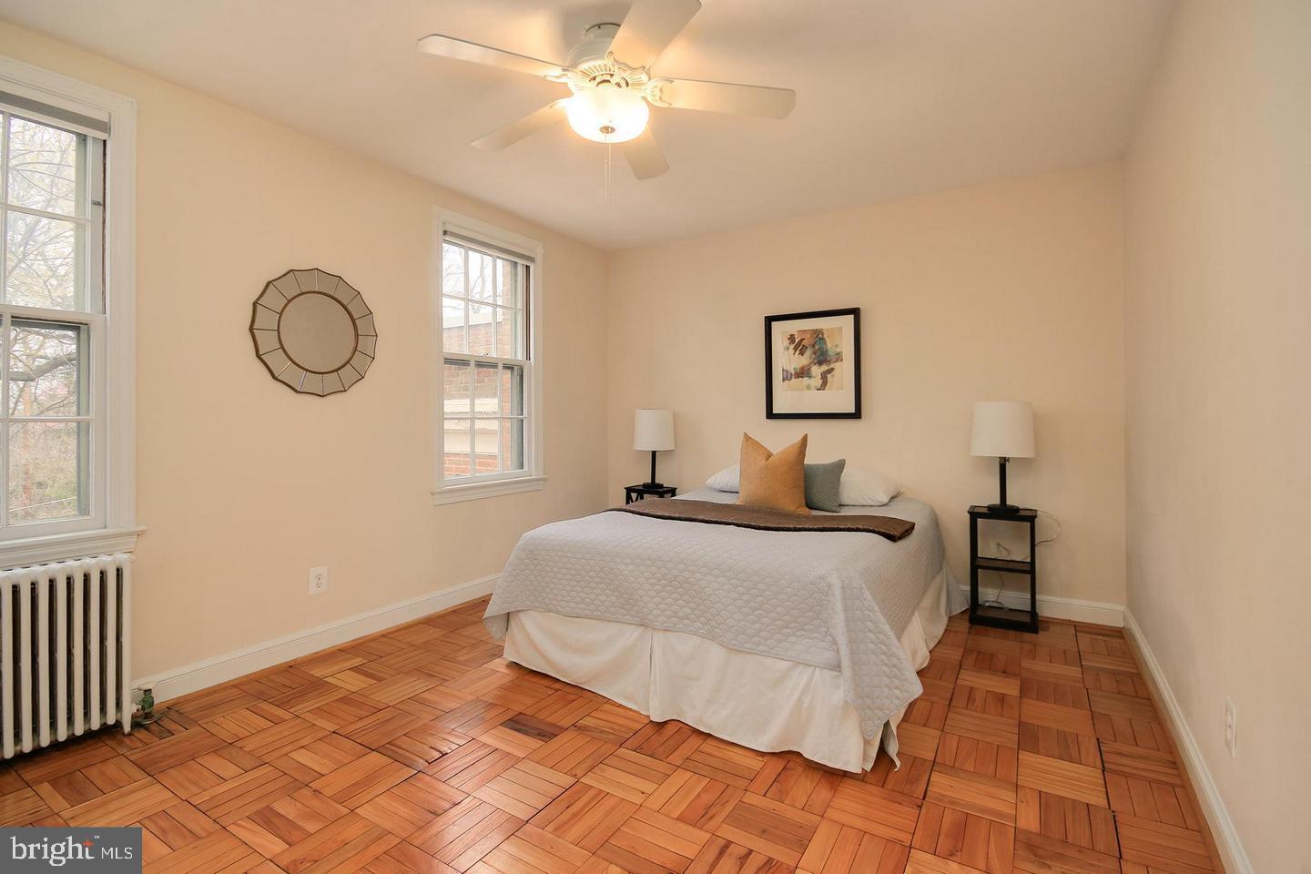 2712 Ordway Street Northwest, Unit 5 Washington, DC 20008 - Photo 19 of 26 a bedroom with a large bed and a window