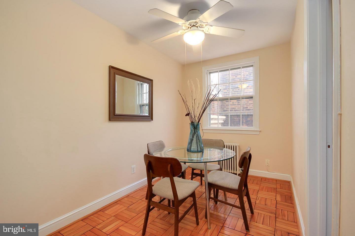 2712 Ordway Street Northwest, Unit 5 Washington, DC 20008 - Photo 7 of 26 a view of a dining room with furniture and a window