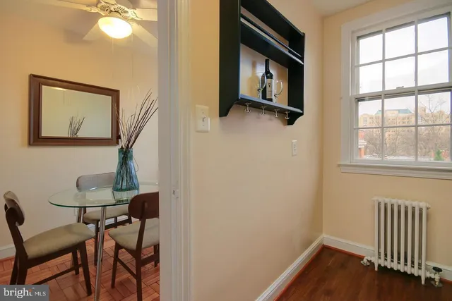 a view of a hallway with seating area