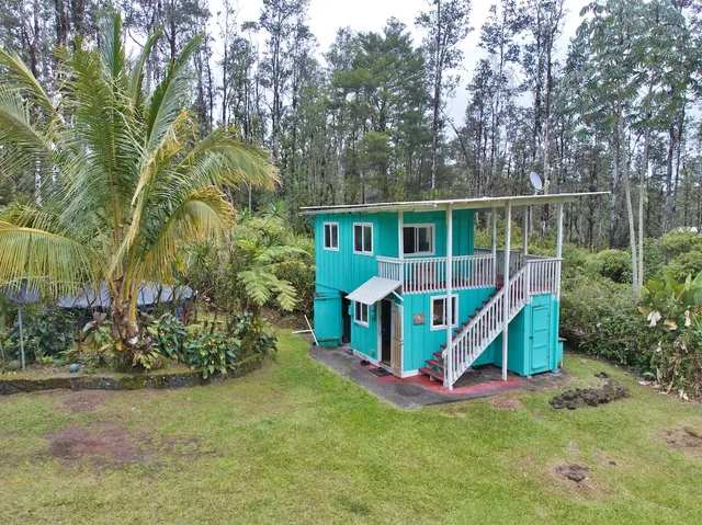a view of ocean with green space