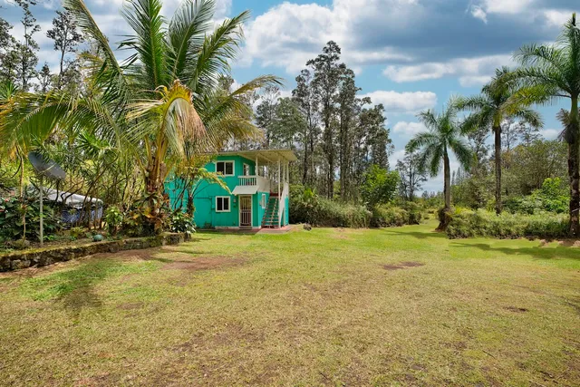 a view of a trees in front of a house