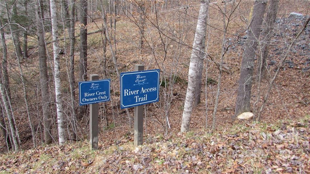 0 High Peak Ridge, Unit 7 Green Mountain, NC 28740 - Photo 20 of 27 a brick building with a bench and trees
