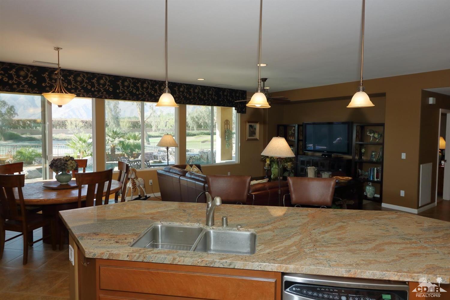 81757 Rustic Canyon Drive La Quinta, CA 92253 - Photo 15 of 40 a kitchen with a table and chairs