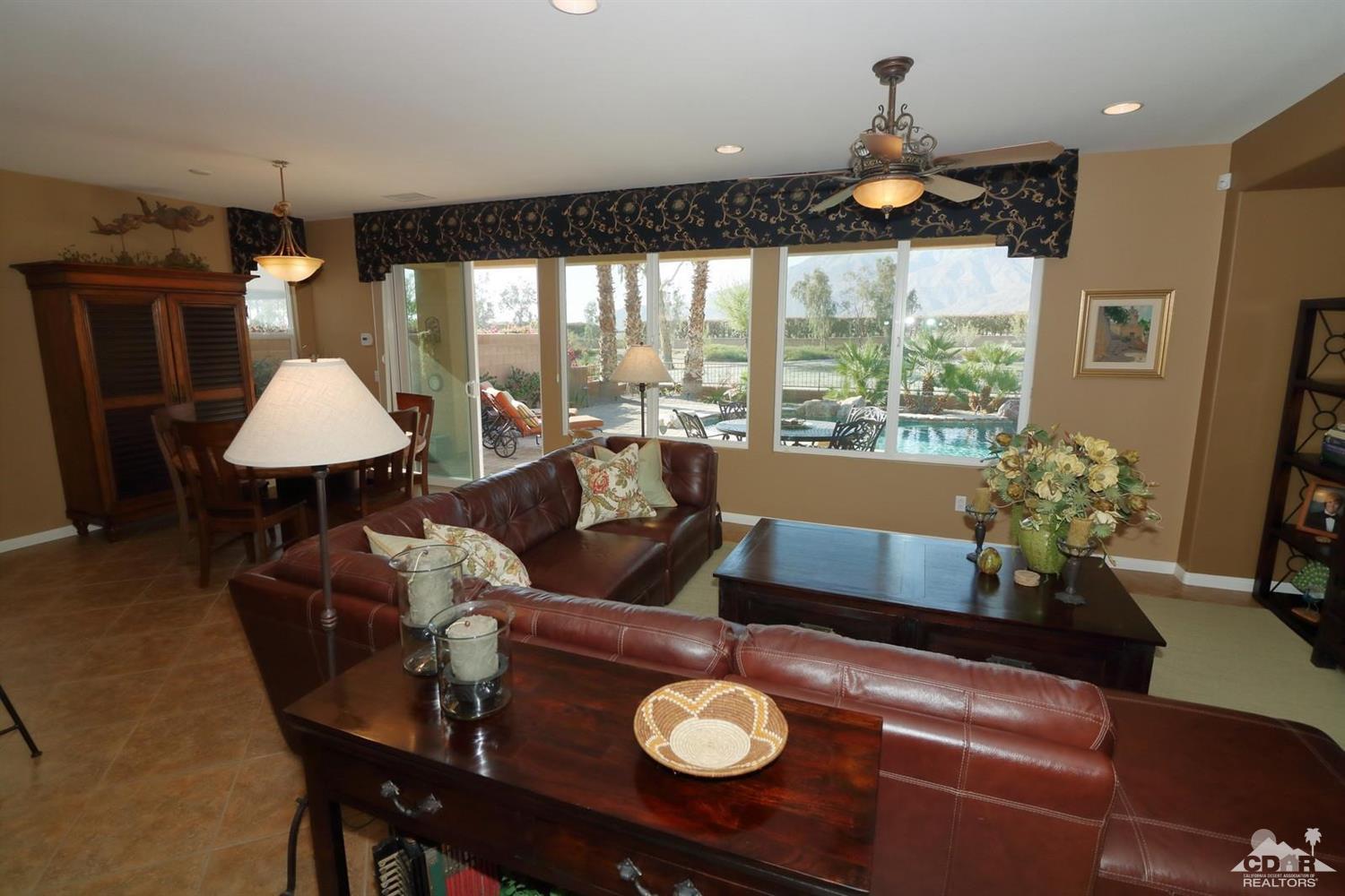 81757 Rustic Canyon Drive La Quinta, CA 92253 - Photo 18 of 40 a living room with furniture and a large window