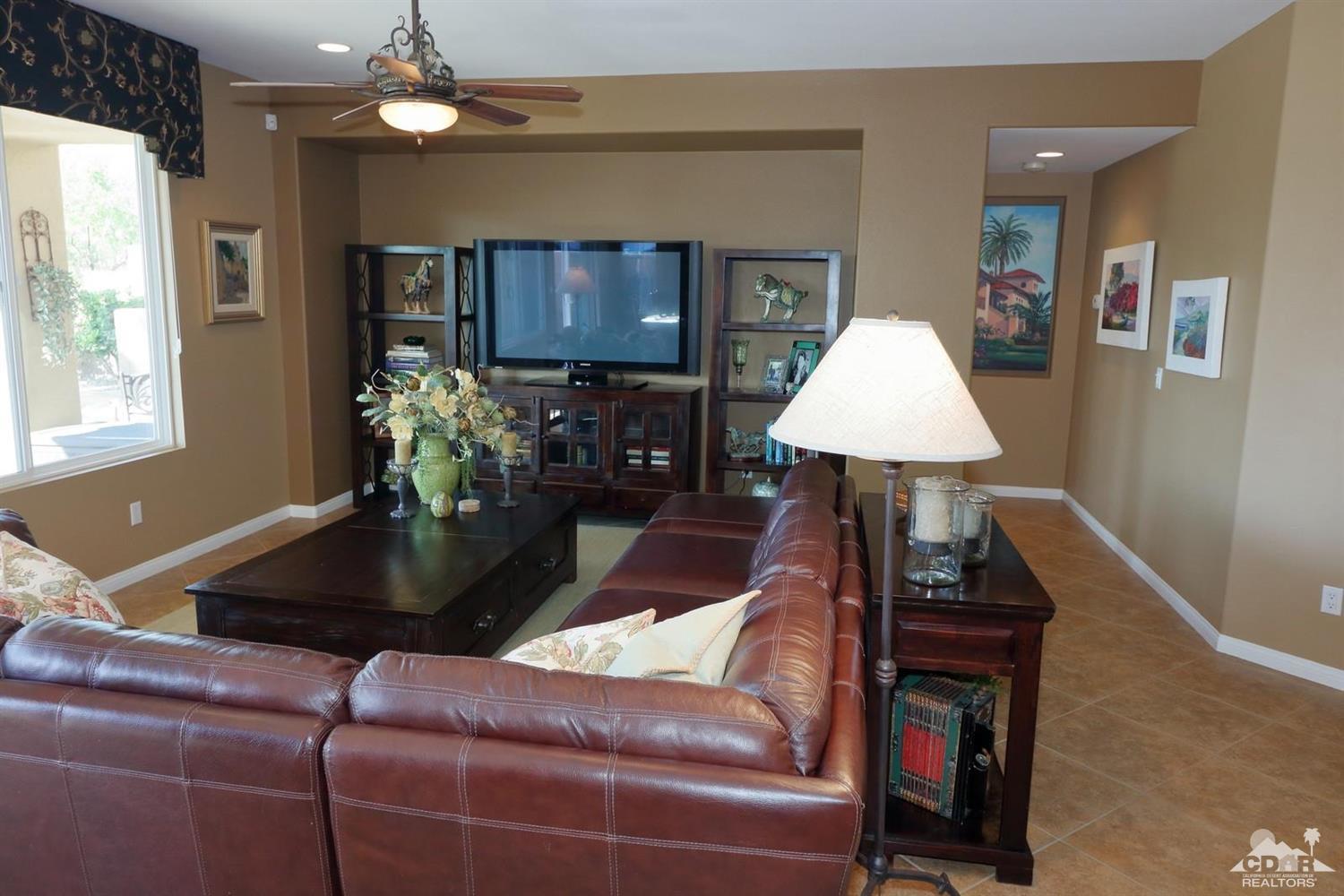 81757 Rustic Canyon Drive La Quinta, CA 92253 - Photo 19 of 40 a living room with furniture and a lamp