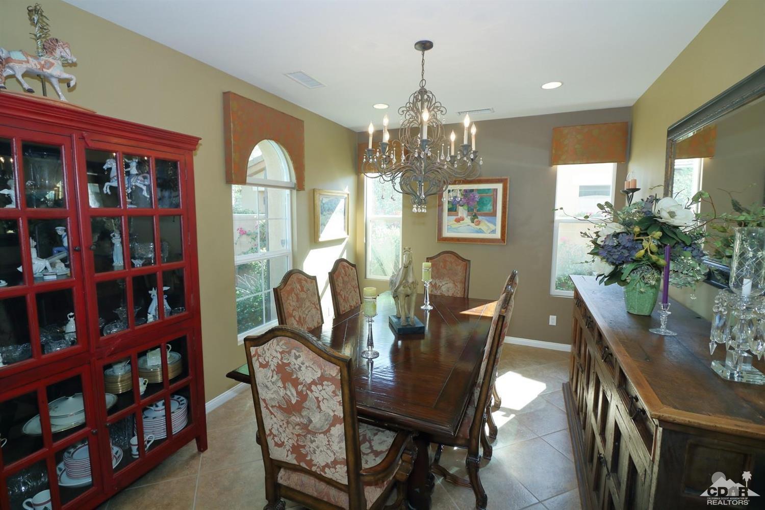 81757 Rustic Canyon Drive La Quinta, CA 92253 - Photo 20 of 40 a view of a dining room with furniture a rug and wooden floor