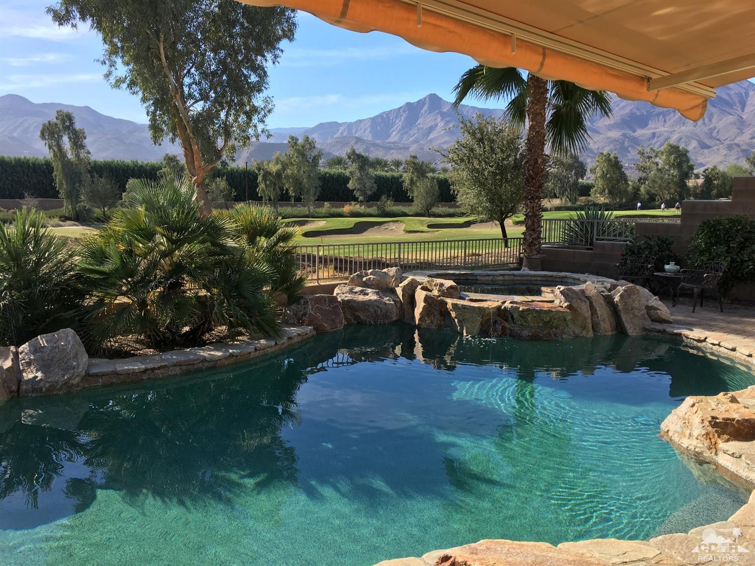 81757 Rustic Canyon Drive La Quinta, CA 92253 - Photo 3 of 40 a view of a lake with a yard