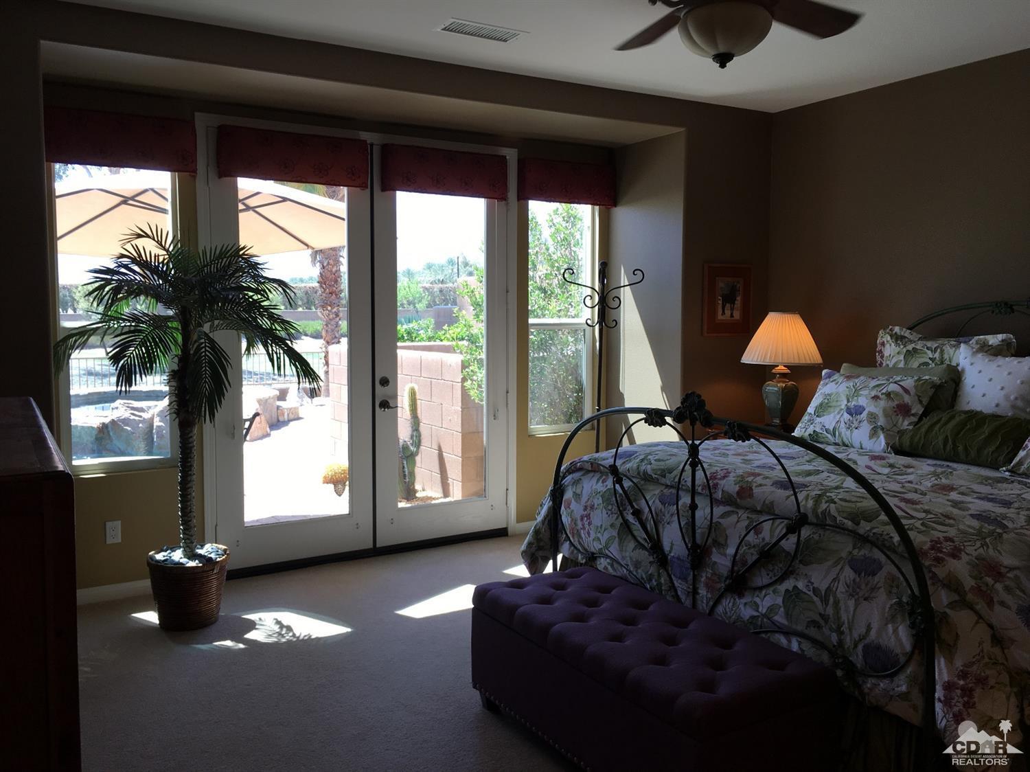 81757 Rustic Canyon Drive La Quinta, CA 92253 - Photo 24 of 40 a bed sitting in a bedroom next to a window