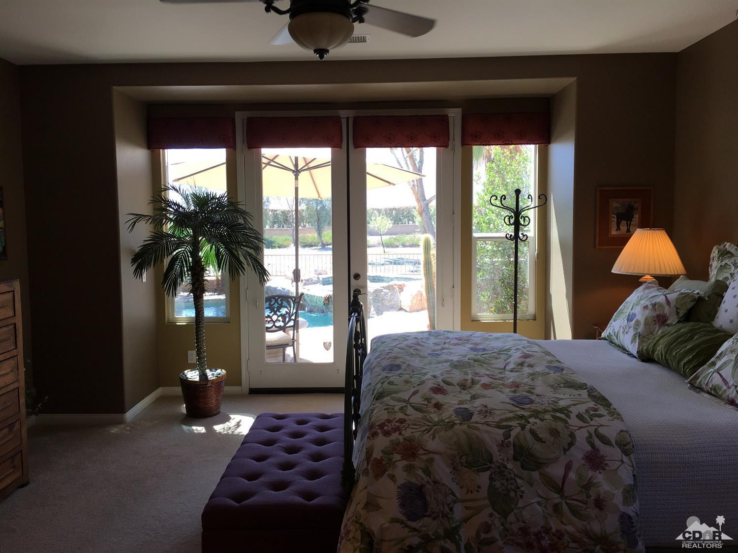 81757 Rustic Canyon Drive La Quinta, CA 92253 - Photo 25 of 40 a bedroom with a large bed and a large window