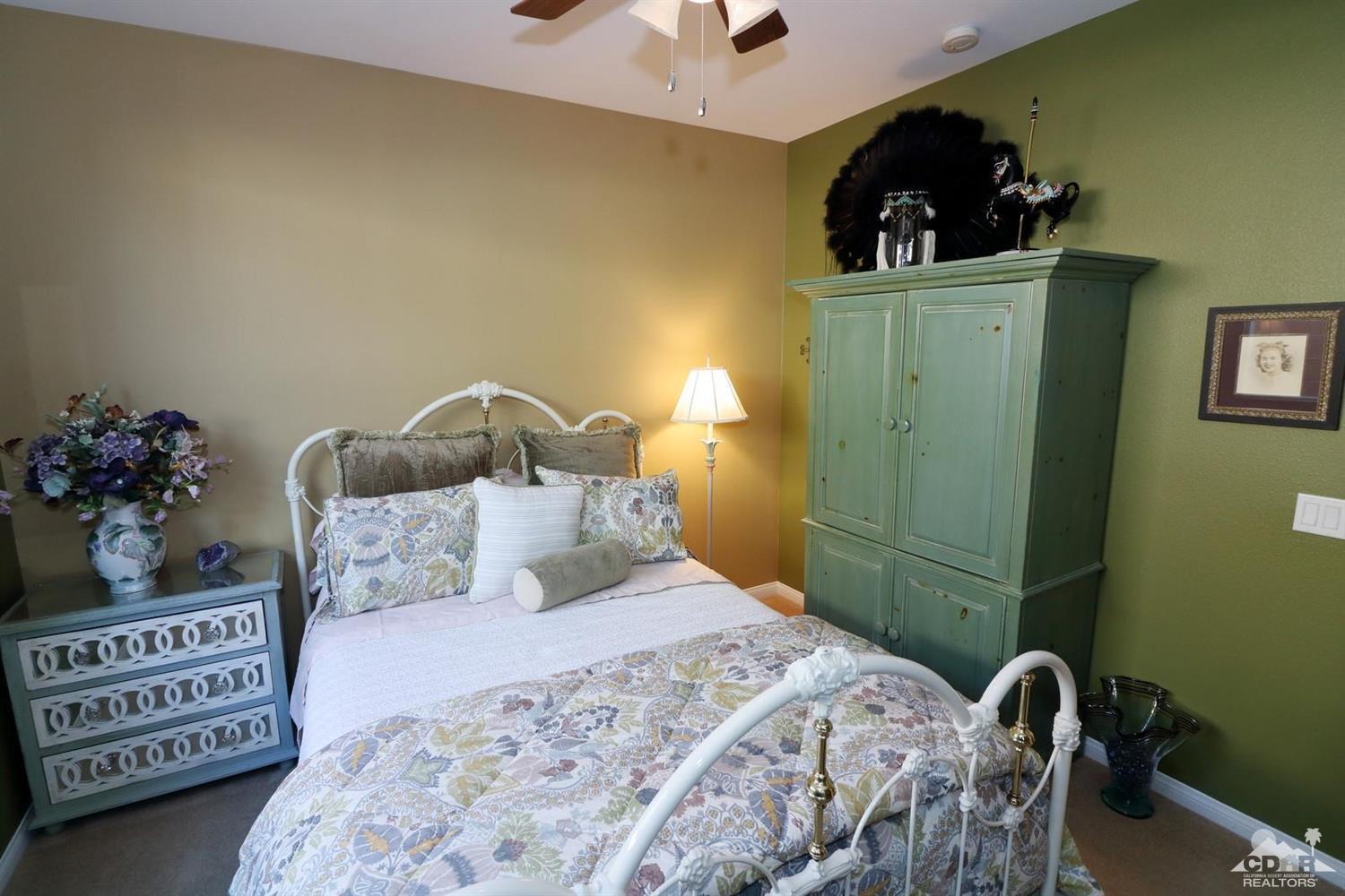81757 Rustic Canyon Drive La Quinta, CA 92253 - Photo 26 of 40 a bedroom with a bed and a dresser