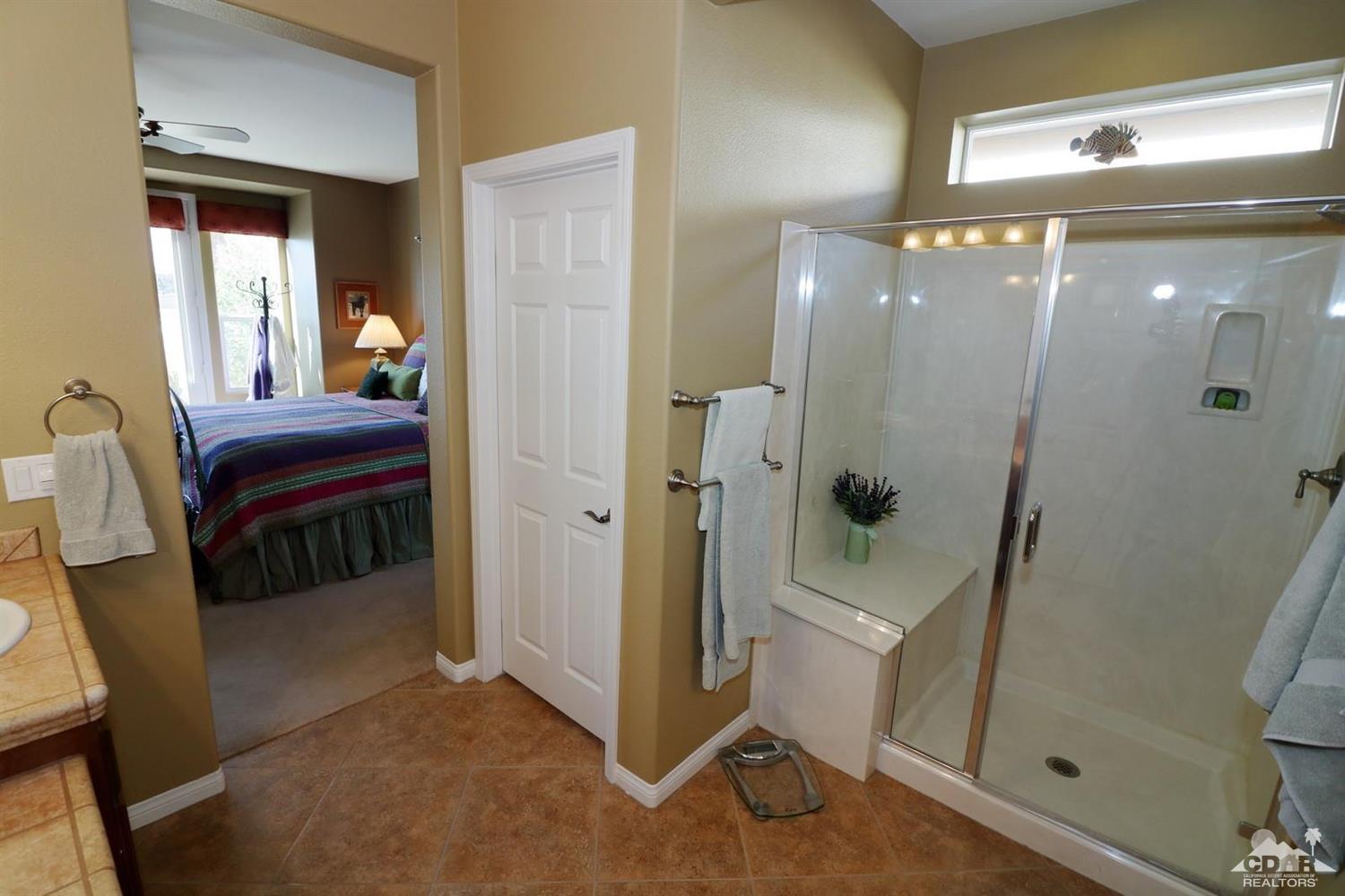 81757 Rustic Canyon Drive La Quinta, CA 92253 - Photo 27 of 40 a view of a bathroom with a glass door shower