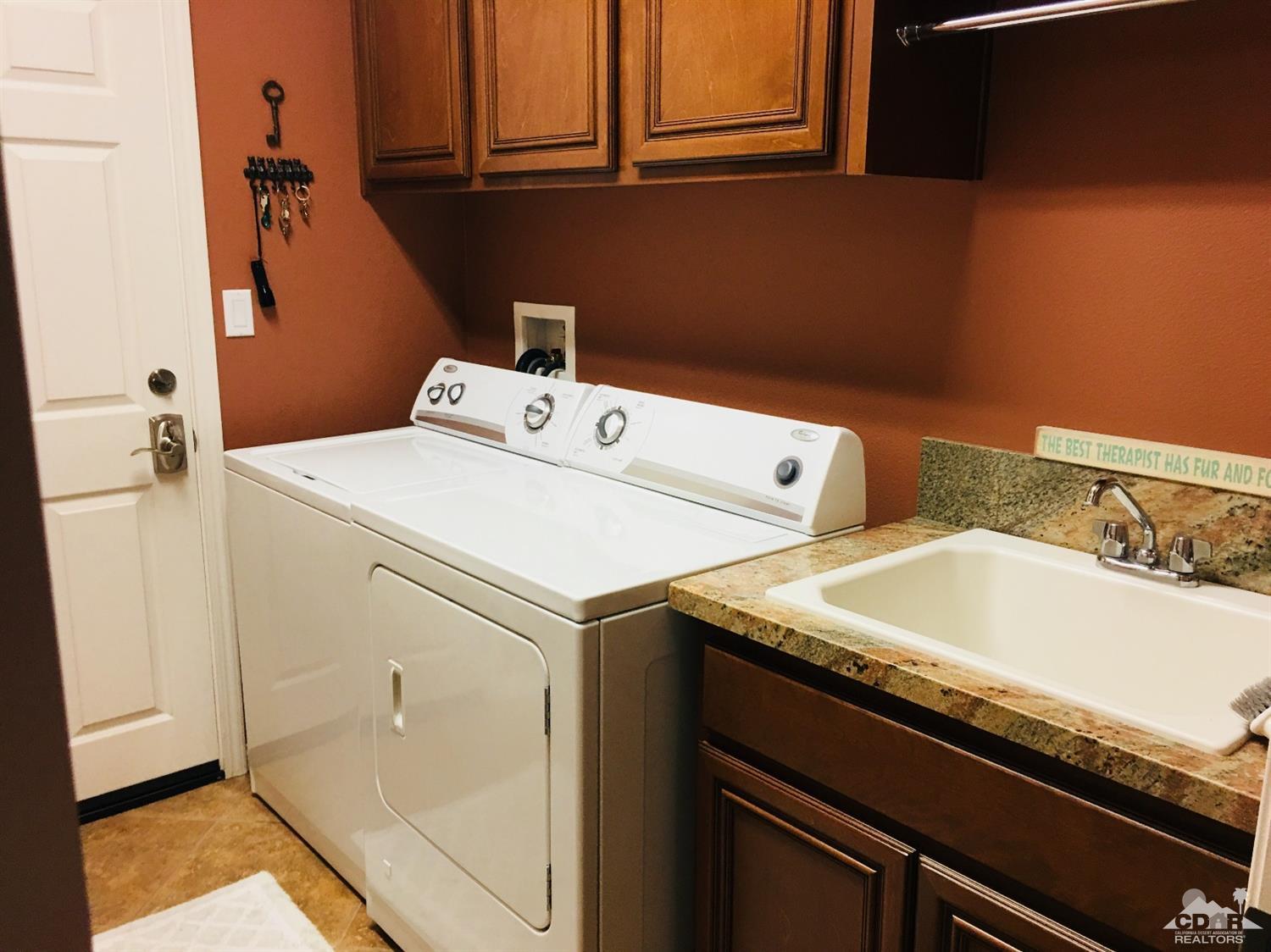 81757 Rustic Canyon Drive La Quinta, CA 92253 - Photo 28 of 40 a utility room with dryer and washer