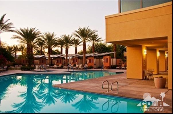81757 Rustic Canyon Drive La Quinta, CA 92253 - Photo 33 of 40 a view of a patio with table and chairs potted plants and palm tree
