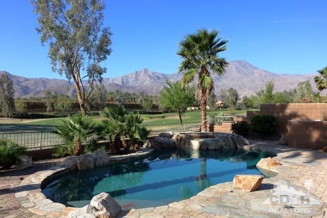 81757 Rustic Canyon Drive La Quinta, CA 92253 - Photo 7 of 40 a view of a backyard with couches plants and large trees