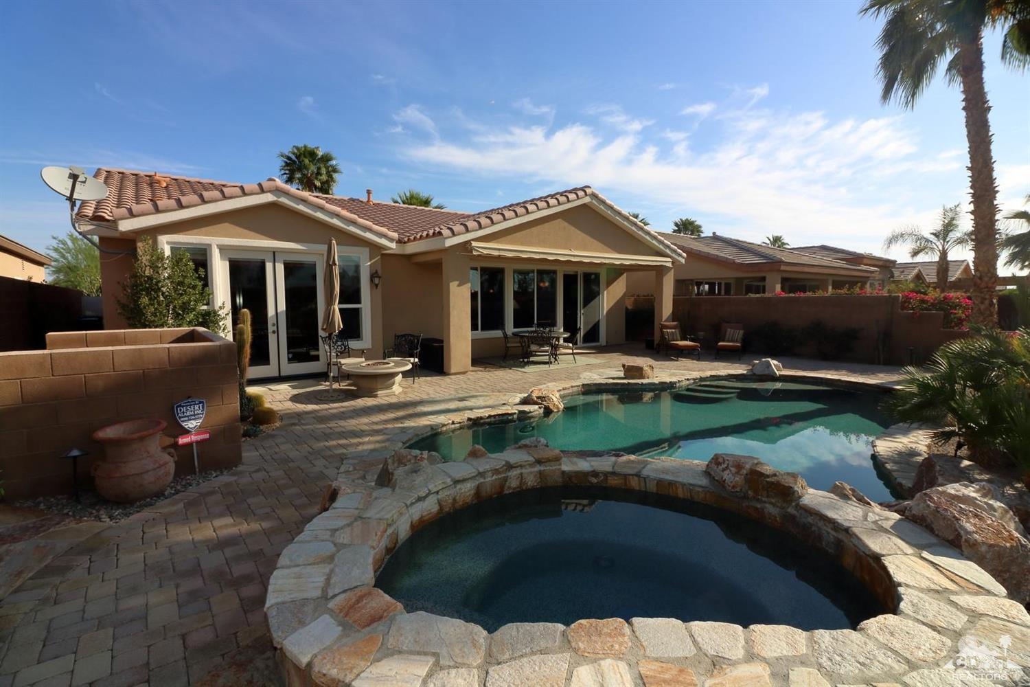 81757 Rustic Canyon Drive La Quinta, CA 92253 - Photo 9 of 40 a front view of a house with garden