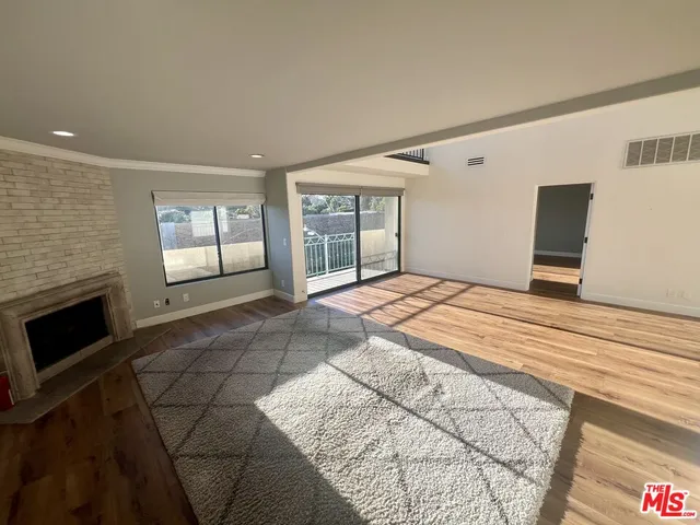 a bedroom with a bed and a fireplace