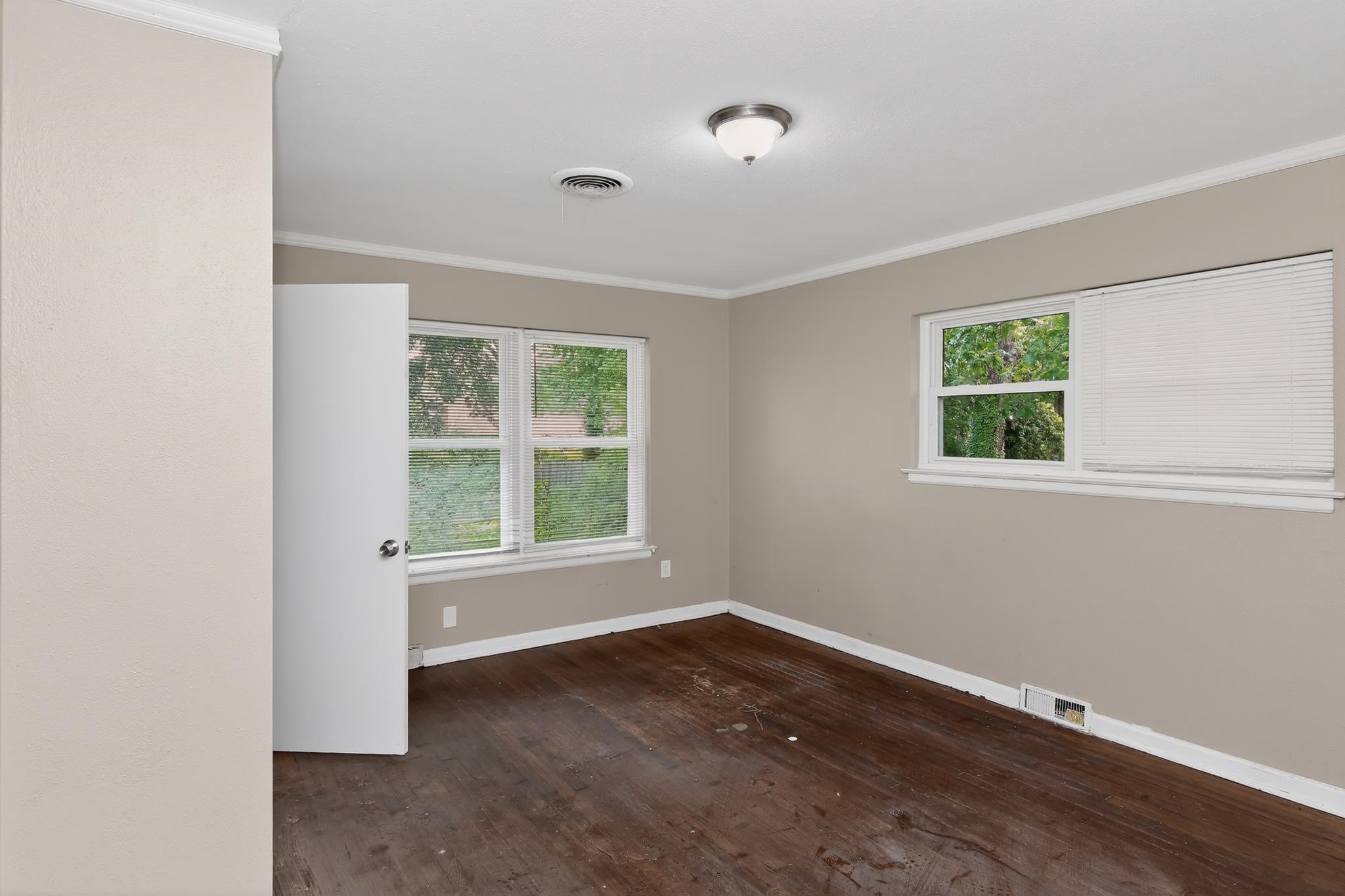 1403 Old Hickory Road Memphis, TN 38116 - Photo 28 of 31 Interior room with neutral wall paint, white trim, and wood-finish flooring