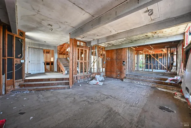 a view of an empty room with wooden roof