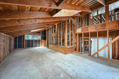 a view of a room with wooden floor
