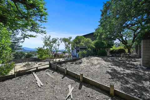 a view of a glass door with a balcony from a window