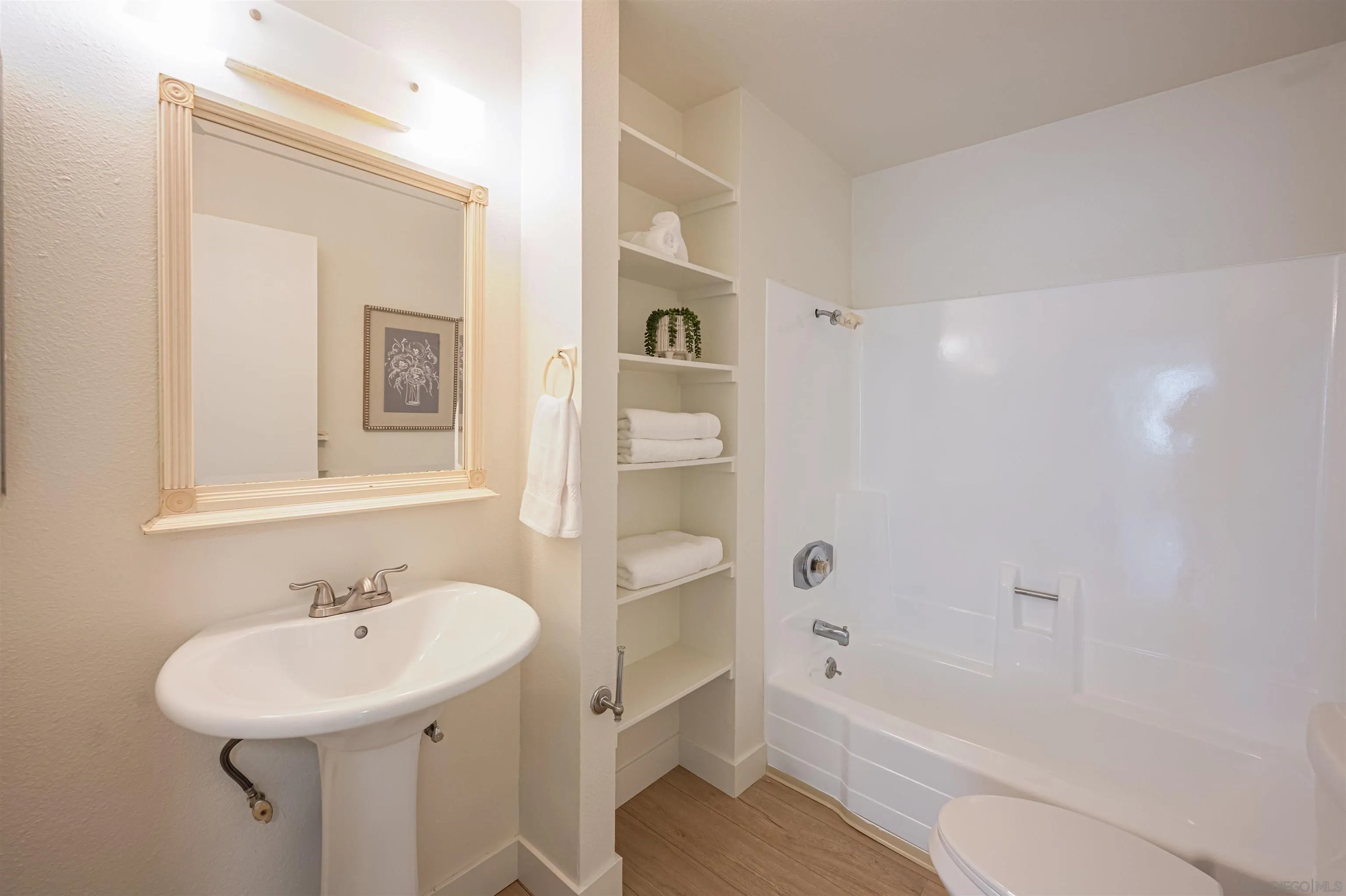 12609 Robison Boulevard, Unit 108 Poway, CA 92064 - Photo 15 of 27 a bathroom with a sink a toilet and shower