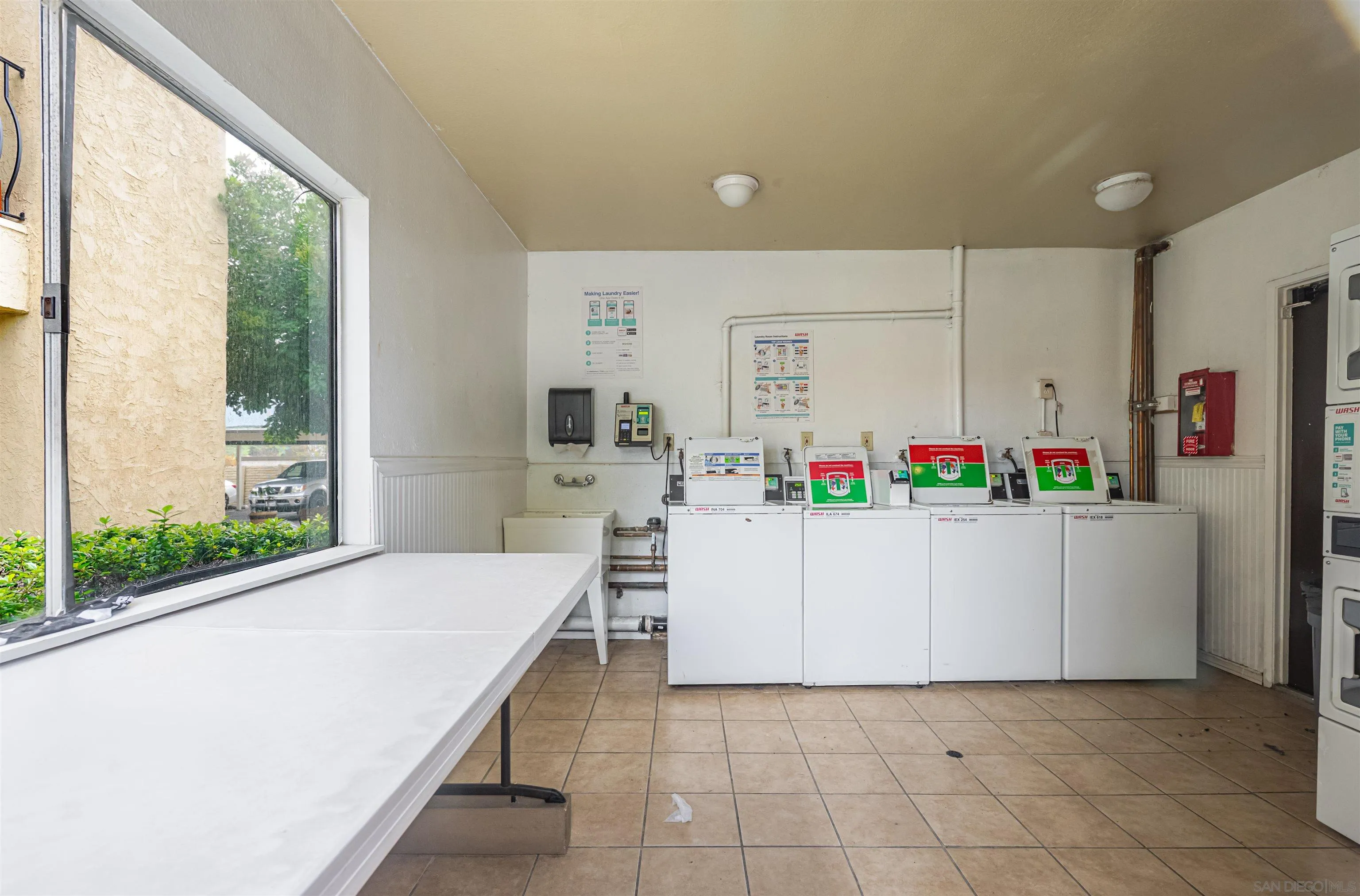 12609 Robison Boulevard, Unit 108 Poway, CA 92064 - Photo 17 of 27 a living room with furniture and a table