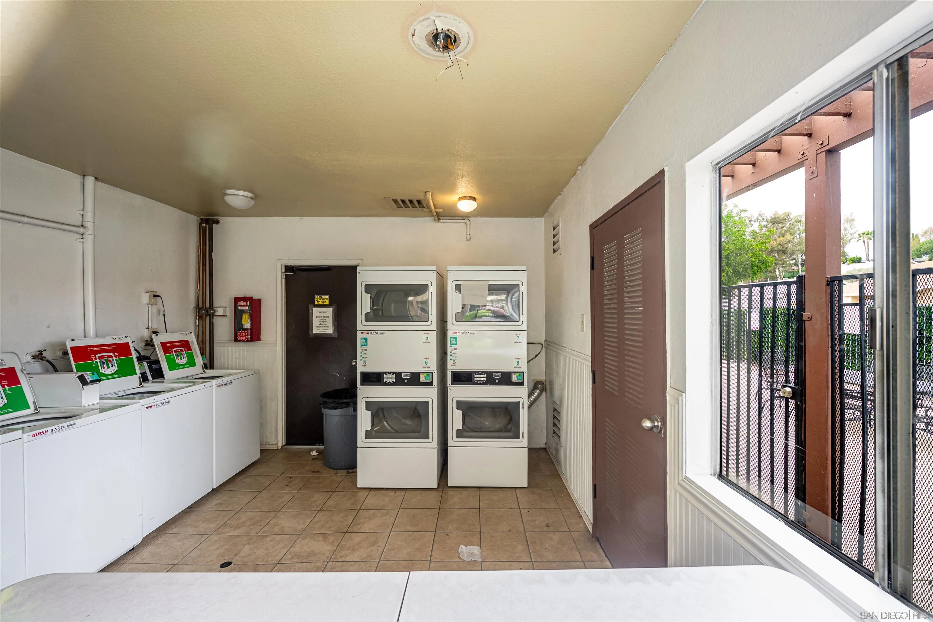 12609 Robison Boulevard, Unit 108 Poway, CA 92064 - Photo 20 of 27 a view of a hallway with kitchen and entryway