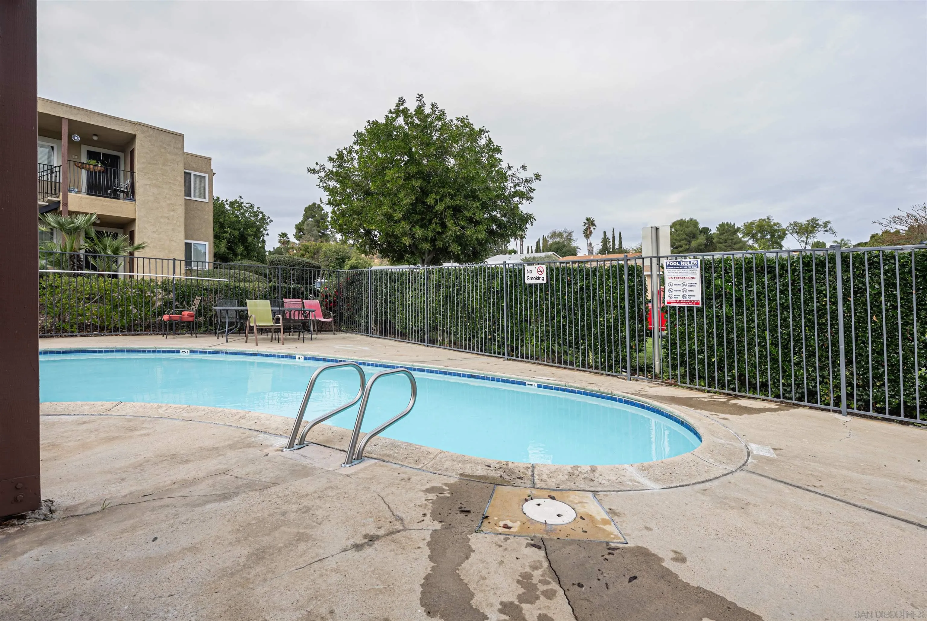 12609 Robison Boulevard, Unit 108 Poway, CA 92064 - Photo 26 of 27 a view of a swimming pool with a patio and a yard