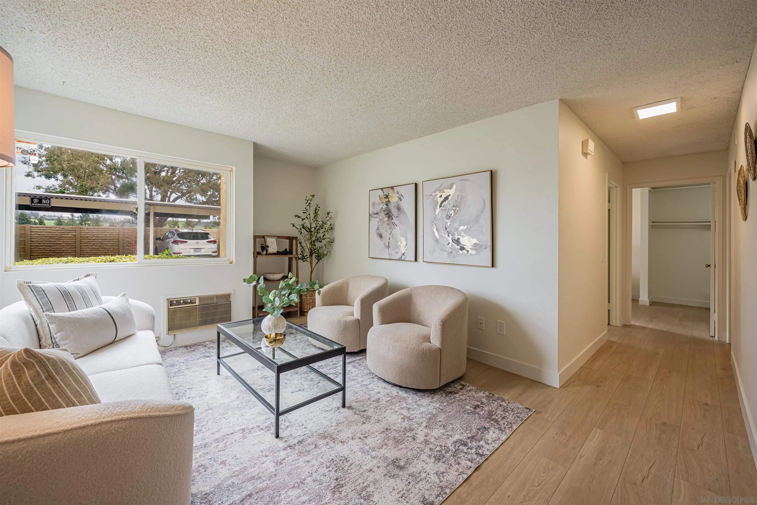12609 Robison Boulevard, Unit 108 Poway, CA 92064 - Photo 7 of 27 a living room with furniture and a large window