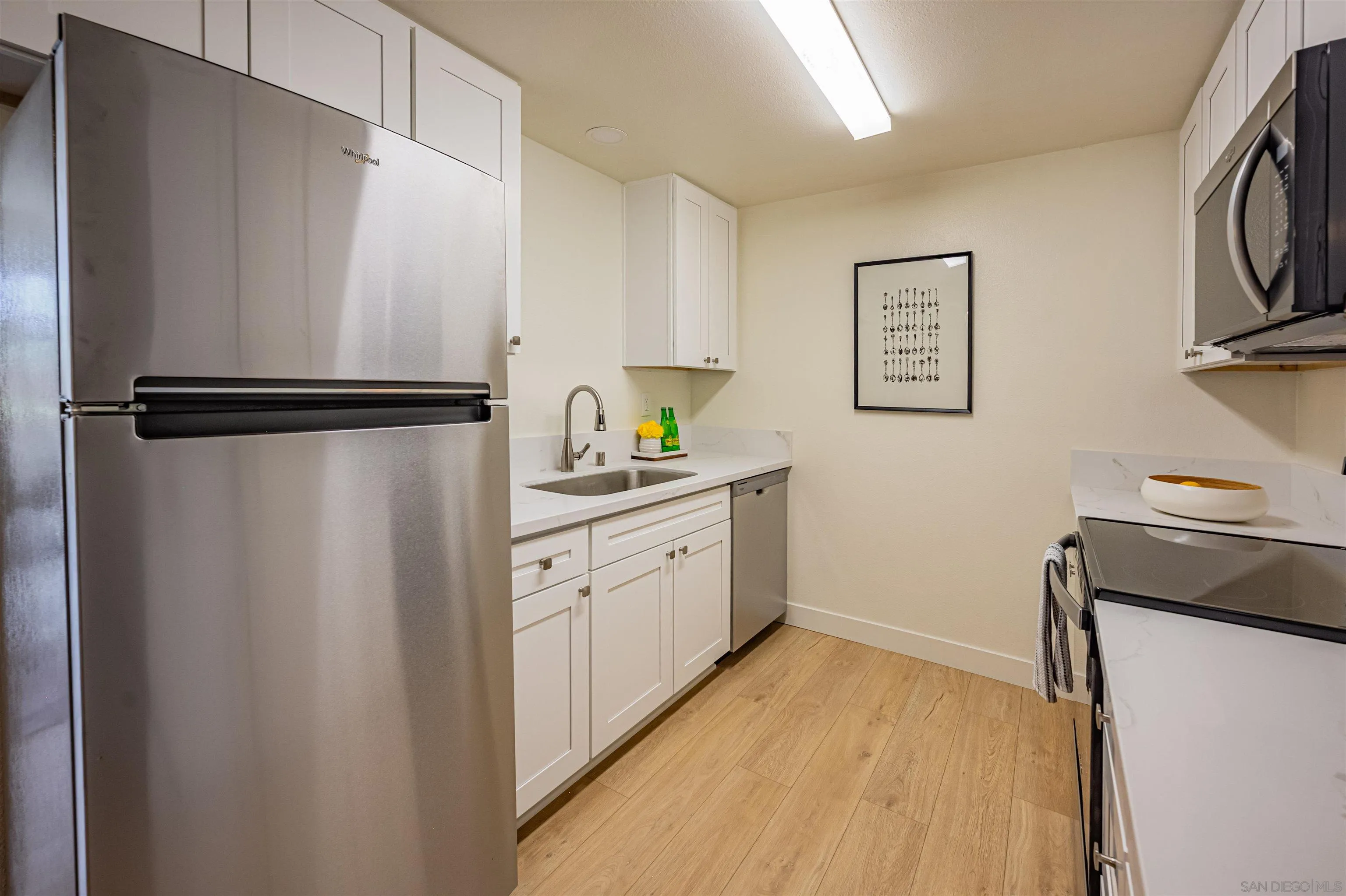 12609 Robison Boulevard, Unit 108 Poway, CA 92064 - Photo 8 of 27 a kitchen with a refrigerator and a stove